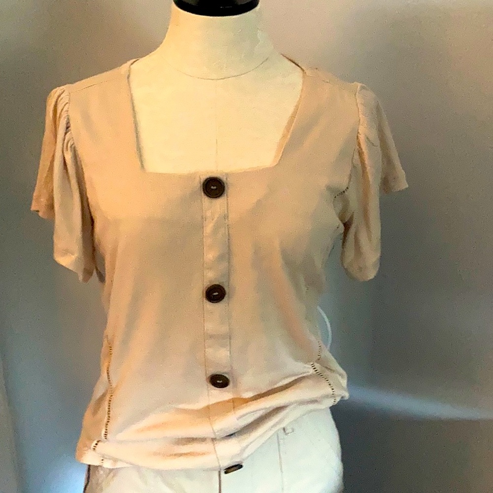 Short sleeve square cut front. Bottoms down front. Detail cuts down front